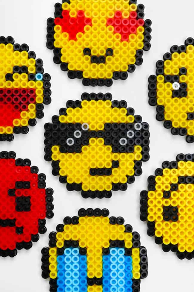 Perler Bead Emoji Closeup on Perler bead emoji designs on a white background