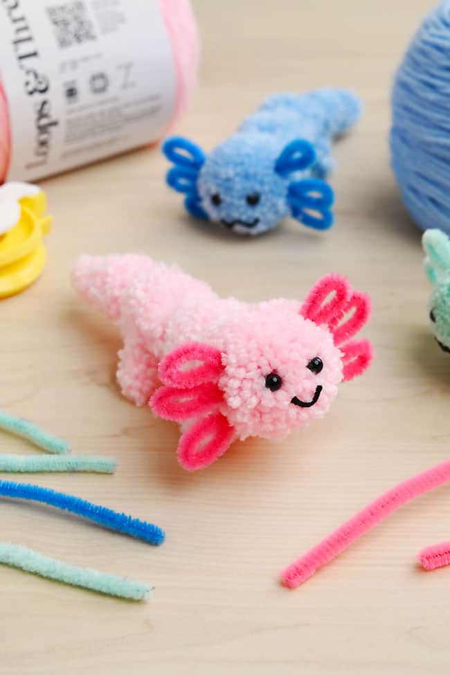 Axolotl Pom Pom Craft Pink and blue axolotl pom pom crafts with supplies to make them