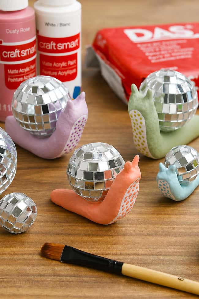 Clay Disco Snail Craft Group of cute clay snails with craft supplies to make them