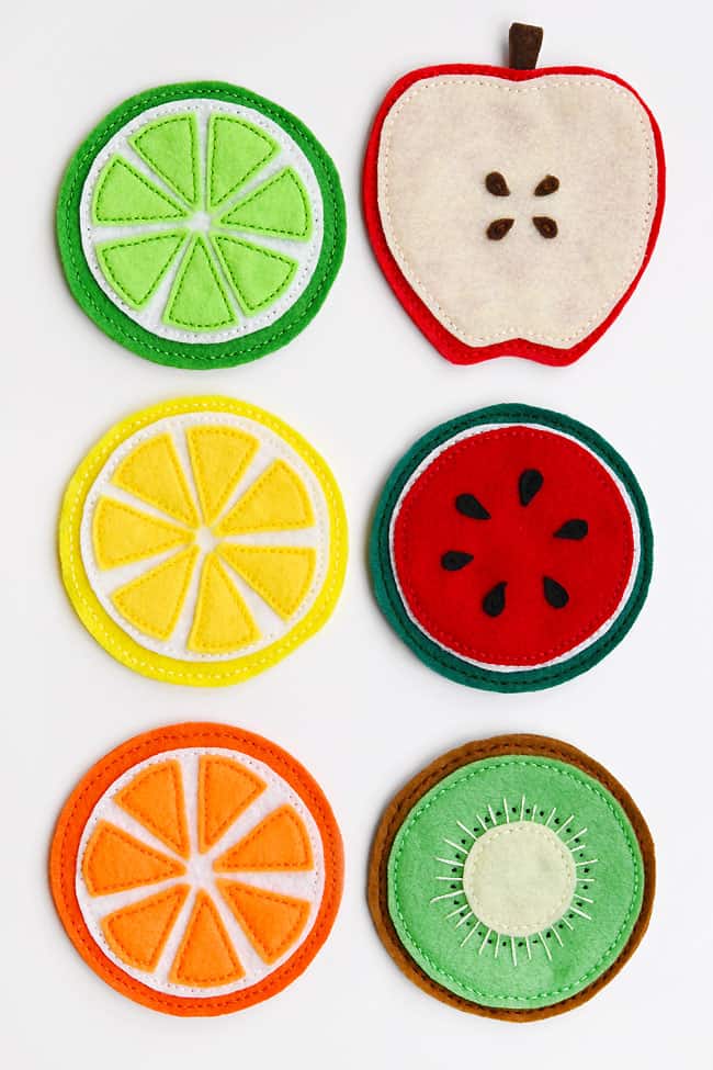 Felt Fruit Coasters Fruit coasters made of felt shaped like lime, apple, lemon, watermelon, orange, and kiwi