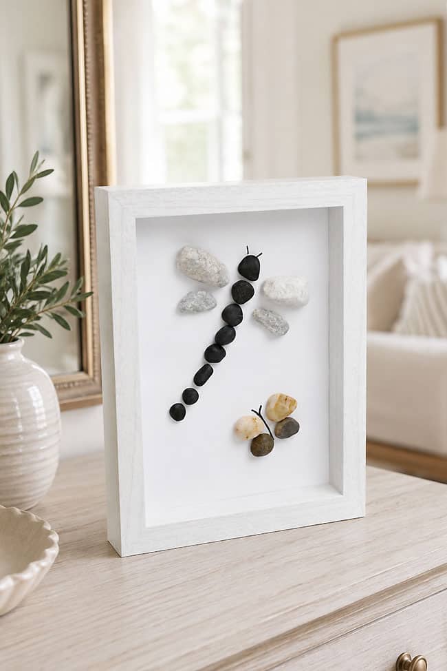 Dragonfly and butterfly art made with pebbles