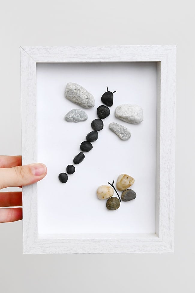 Rock Art Holding an insect rock art picture