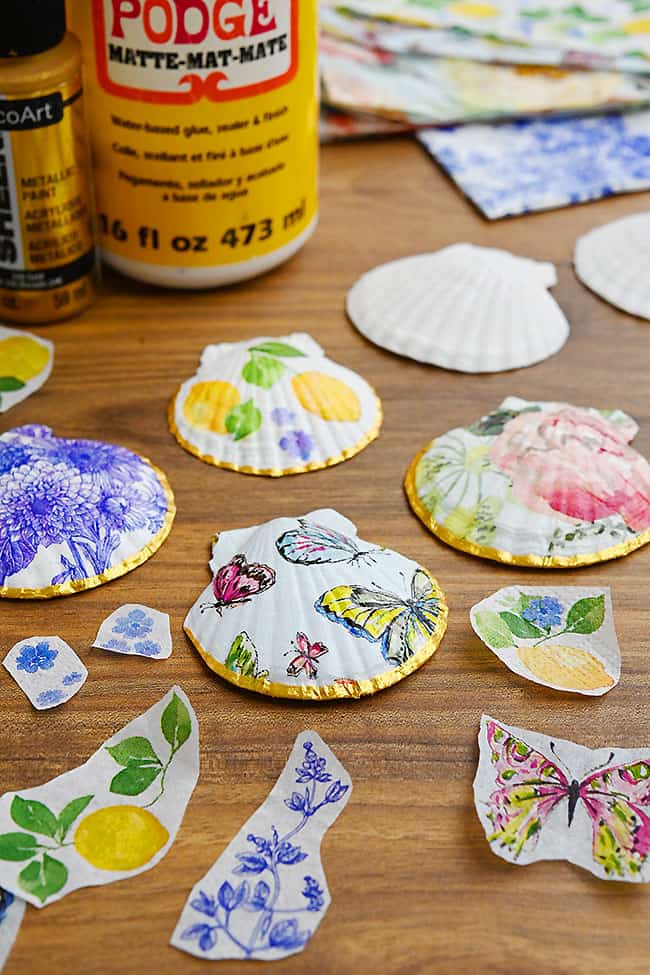 Decoupage Shells with Napkins Decoupage shells with craft supplies to make more