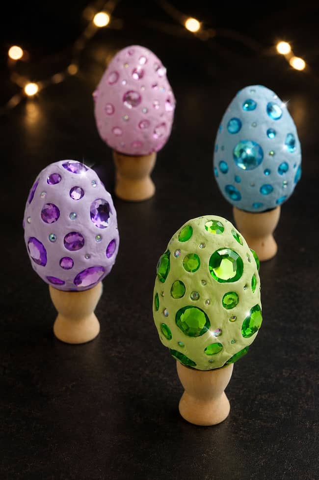 Dragon Egg Designs Green, purple, blue, and pink dragon eggs on display