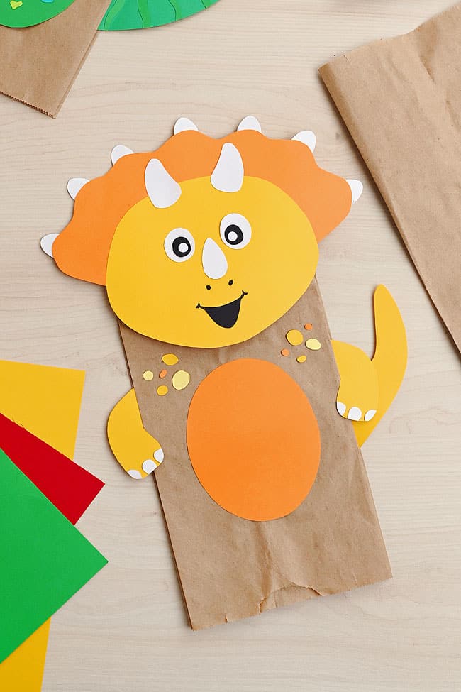 Paper Bag Dinosaur Puppet Cute triceratops paper dinosaur puppet and craft supplies to make more