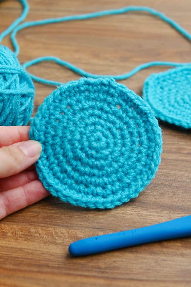 Holding a round, flat crochet circle