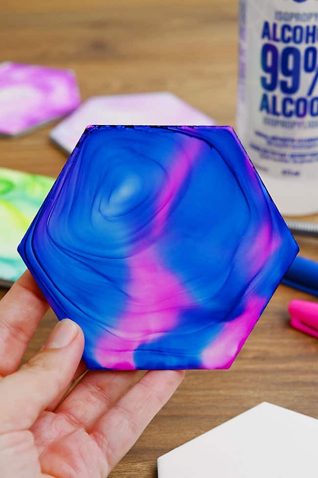 Sharpie and Alcohol Coasters Showing the beautiful pattern that fire makes on these ceramic tile coasters