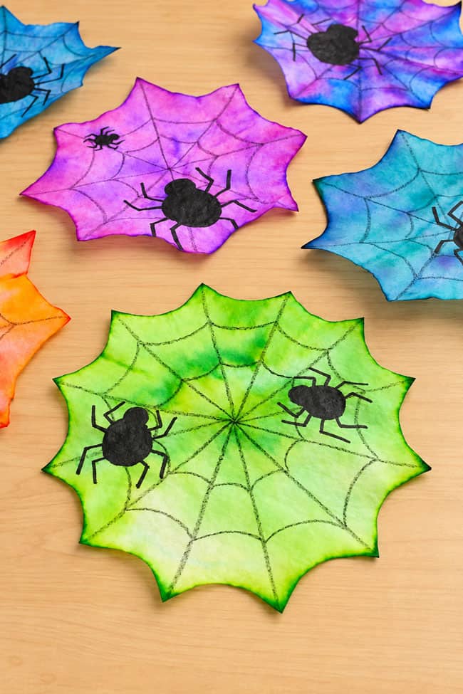 Coffee Filter Spider Colorful spiderwebs with drawn black spiders on them