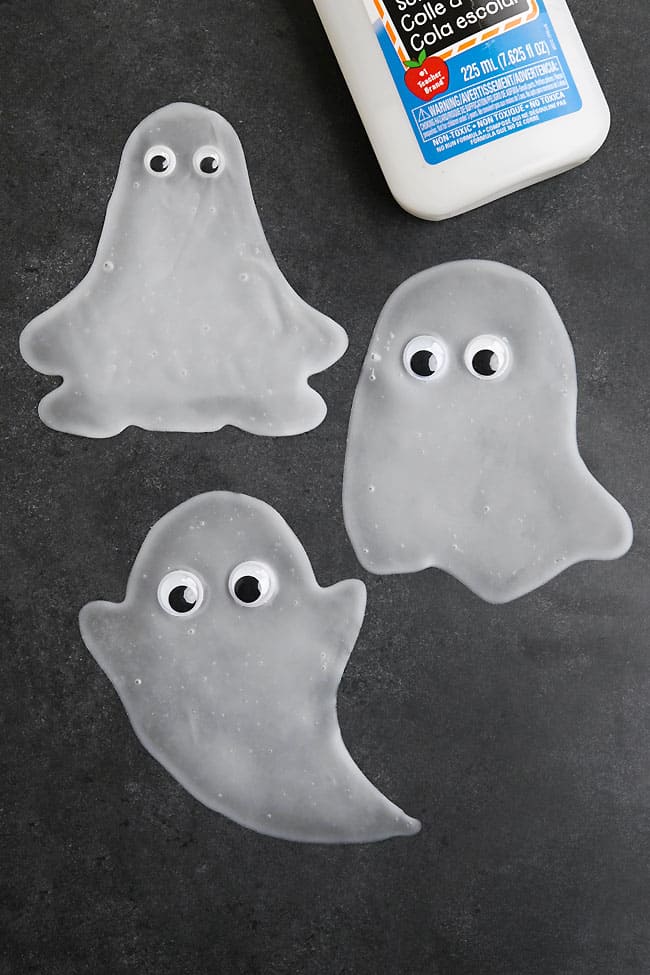 Ghost Window Cling DIY Spooky ghost window clings made with glue and googly eyes