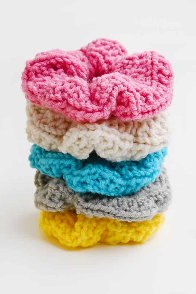 Loom Knit Hair Scrunchie Knit scrunchies made with pink, oatmeal, blue, grey, and yellow yarn