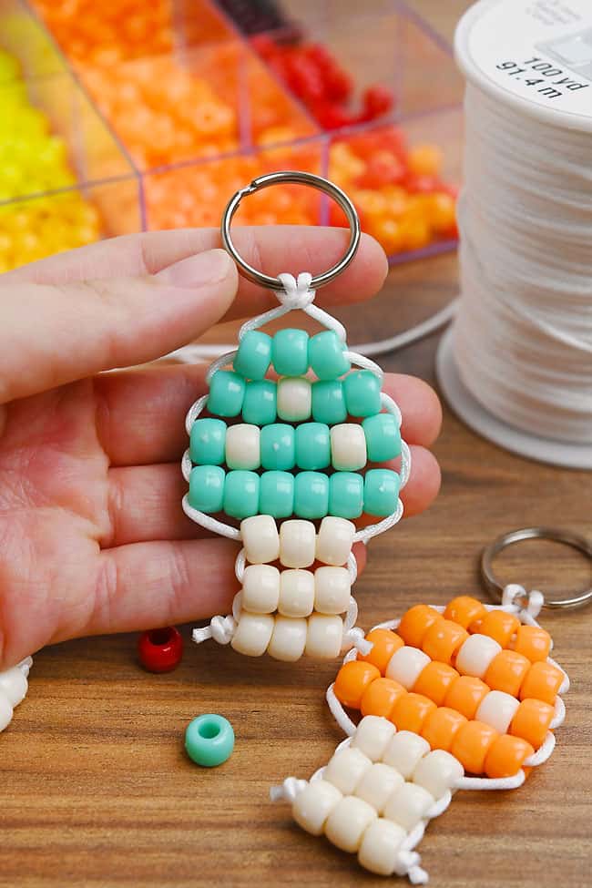 Mushroom Pony Bead Pattern Holding a beaded mushroom with colorful spots