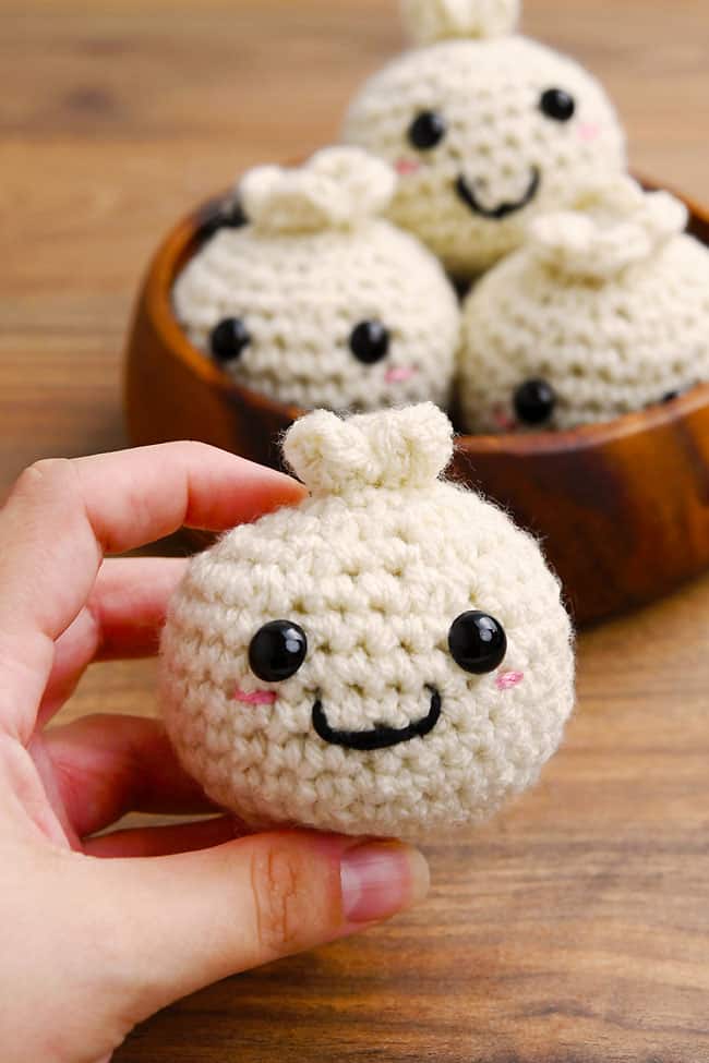 Dumpling Crochet Pattern Holding a cute crochet dumpling