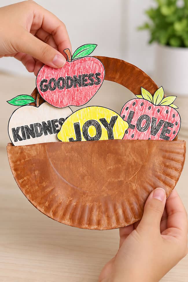 Adding fruit of the spirit printables to a paper plate fruit basket