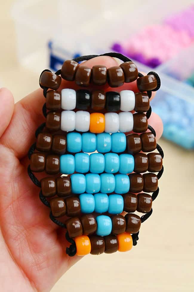 Owl Pony Bead Pattern Closeup on a blue and brown pony bead owl