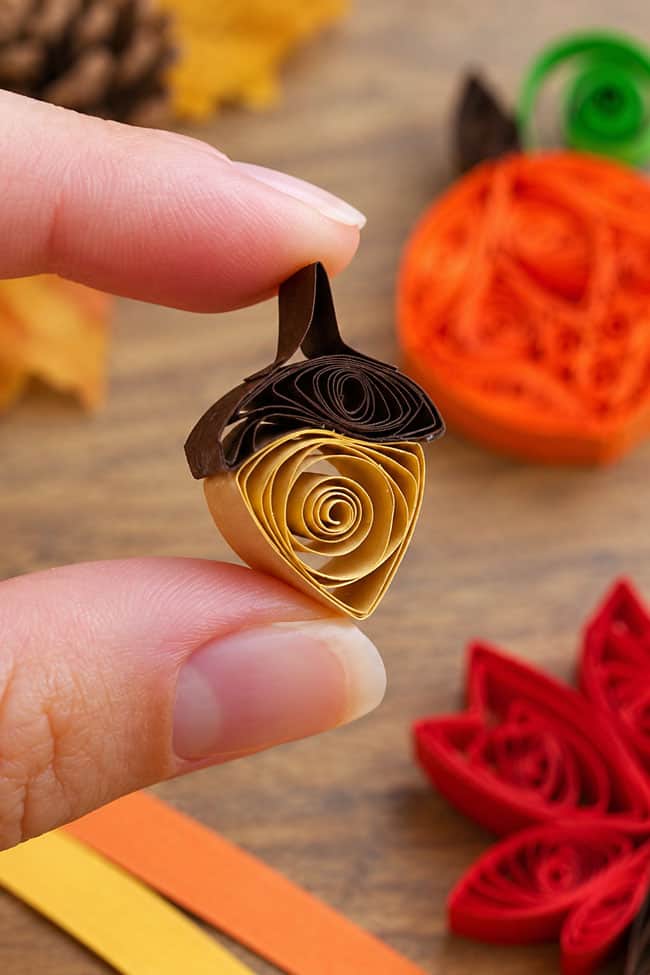 Paper Quilling Acorn Holding a cute little paper quilled acorn